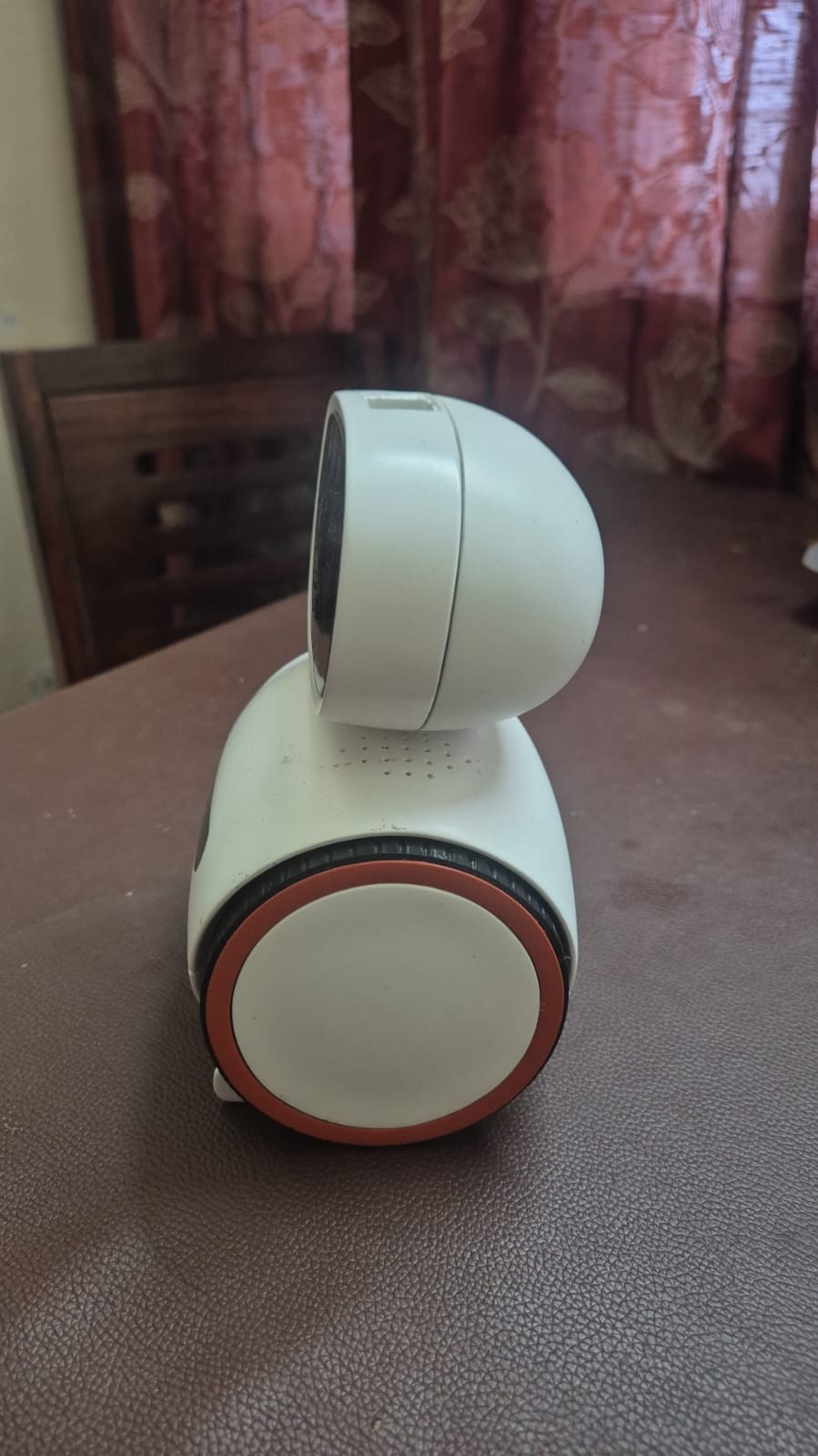 The V3 prototype in profile, showing the rust-orange rim around the white wheel hub